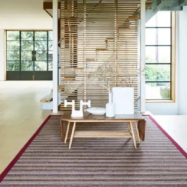 multi-toned, striped sisal rug with a dark red border