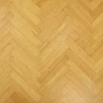 natural-colored bamboo flooring laid in a herringbone pattern.