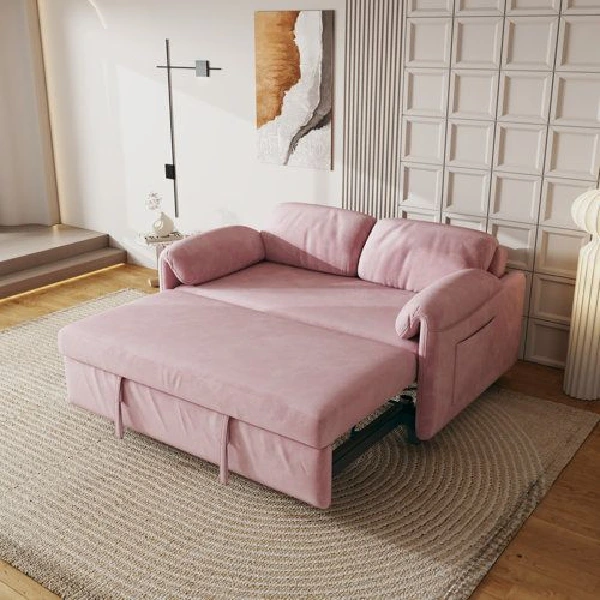 pink velvet sofa bed fully extended into a sleeping position
