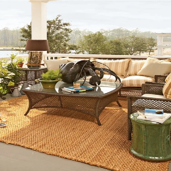 sisal area rug on porch with wicker furniture