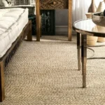 tightly woven natural beige sisal carpet under a wooden frame