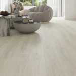 whitewashed wood-look vinyl plank flooring in minimalist modern living room