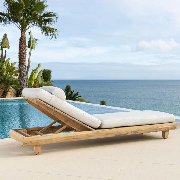 wood sun lounger with a light gray padded cushion